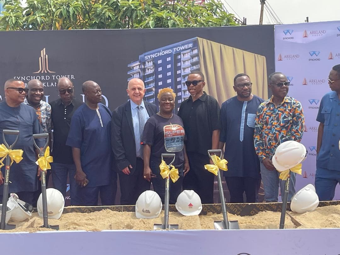 Guests and partners at the Syncord Tower groundbreaking site with ceremonial shovels.